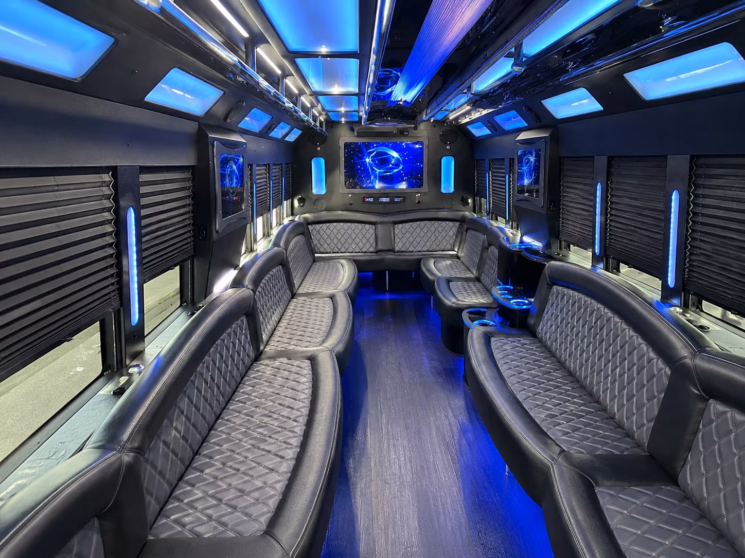 Wedding guests seated inside a party bus serving Jackson
